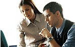 Instructor with student at computer